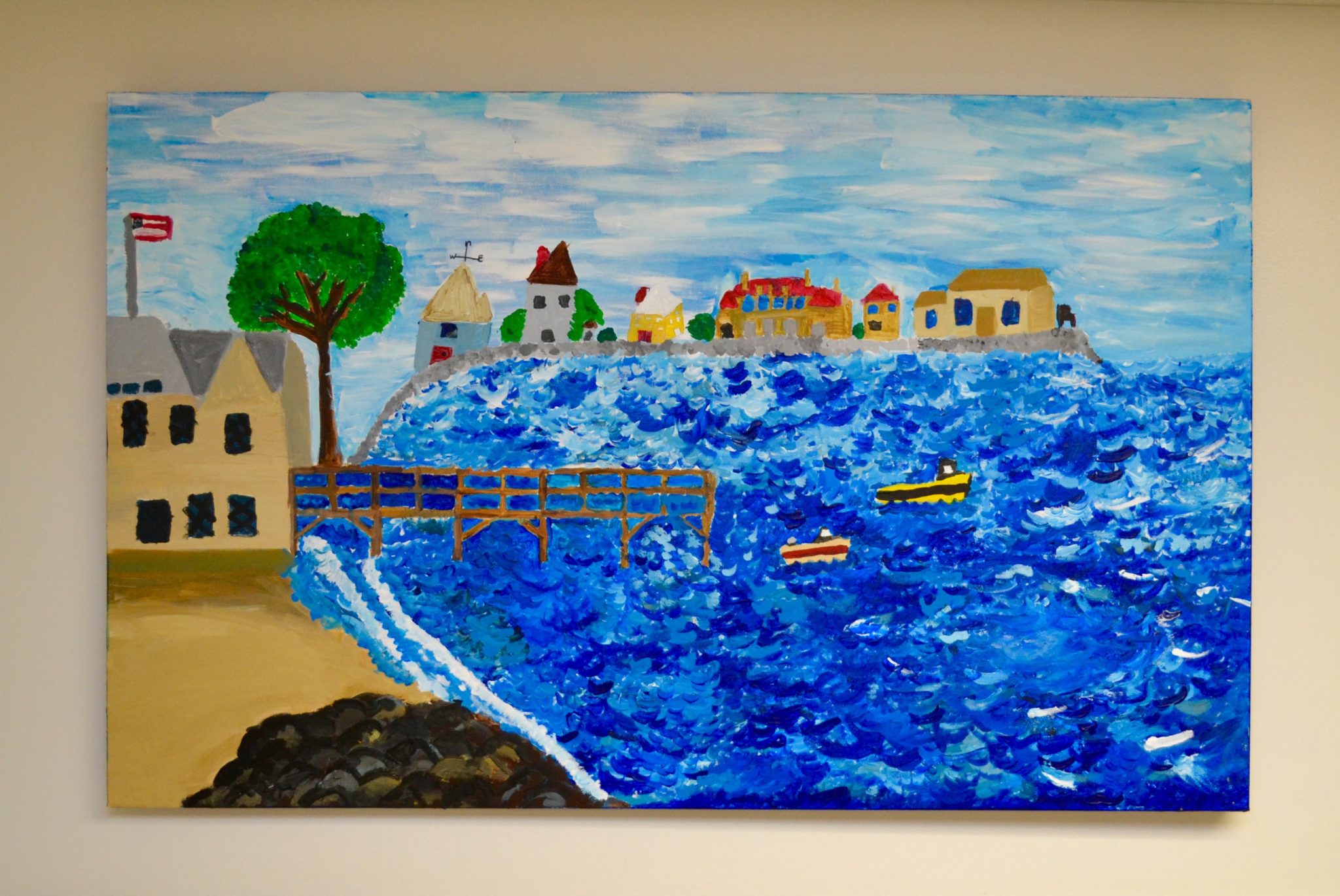 Stanley artwork of the ocean with boats and houses