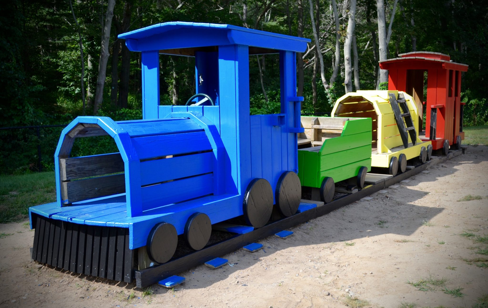 Wooden painted train that sits in Stanley school yard